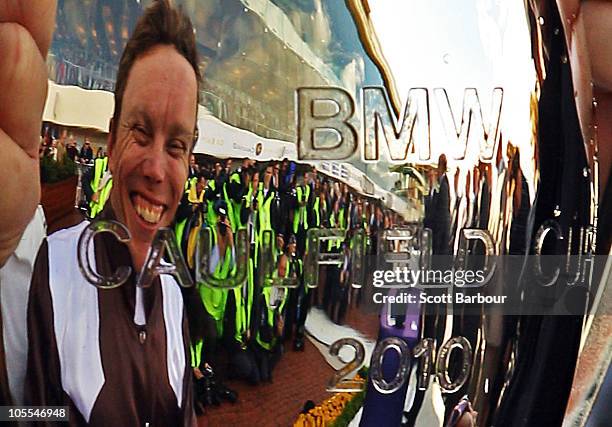 Jockey Chris Munce is reflected in the Caulfield Cup after Descarado won race 8 the BMW Caulfield Cup during Caulfield Cup Day at Caulfield...