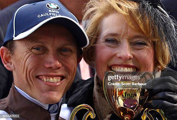 Trainer Gai Waterhouse and Jockey Chris Munce celebrate with the Caulfield Cup after Descarado won race 8 the BMW Caulfield Cup during Caulfield Cup...