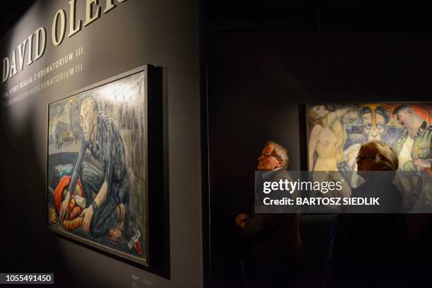 People visit the monographic exhibition with the works of David Olere during the opening at the Auschwitz-Birkenau Memorial in Oswiecim, Poland on...