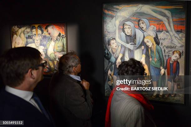 People visit the monographic exhibition with the works of David Olere during the opening at the Auschwitz-Birkenau Memorial in Oswiecim, Poland on...