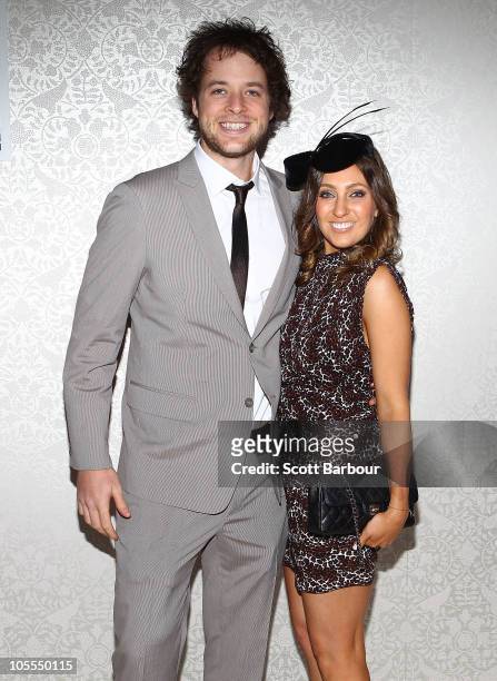 Hamish Blake poses with girlfriend Zoe Foster as they attend BMW Caulfield Cup Day at Caulfield Racecourse on October 16, 2010 in Melbourne,...