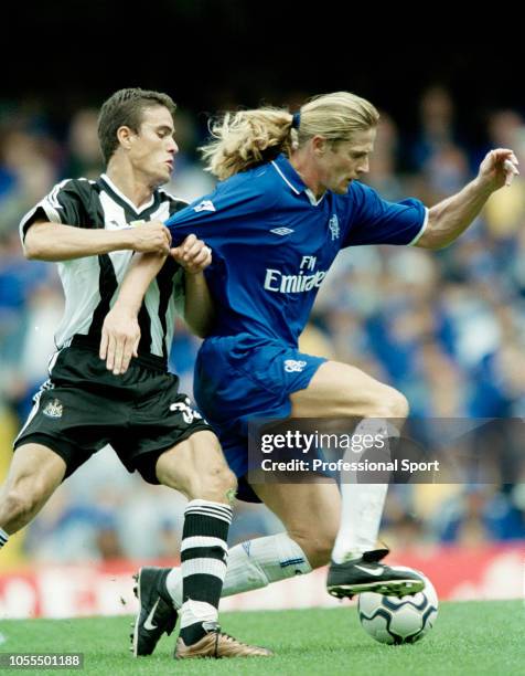 Emmanuel Petit of Chelsea is challenged by Laurent Robert of Newcastle United during an FA Barclaycard Premiership match at Stamford Bridge on August...