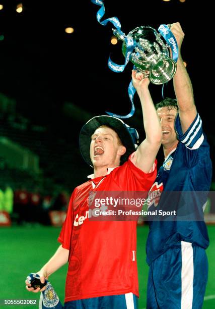 Neil Lennon and Steve Walsh of Leicester City celebrate with the trophy after the Coca Cola League Cup Final Replay between Leicester City and...