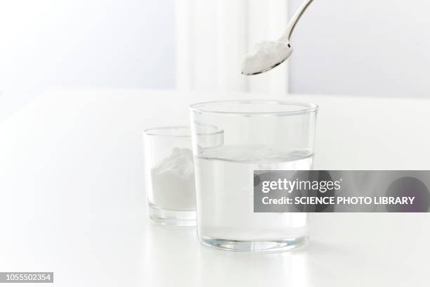 baking soda dissolving in water - baking powder stock pictures, royalty-free photos & images