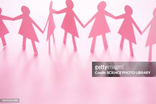 pink cut out paper chain female figures - female likeness stock pictures, royalty-free photos & images