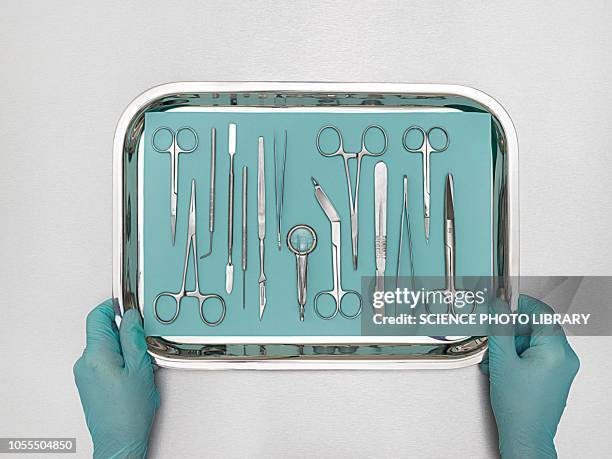 person holding tray with surgical equipment - equipamento cirúrgico imagens e fotografias de stock