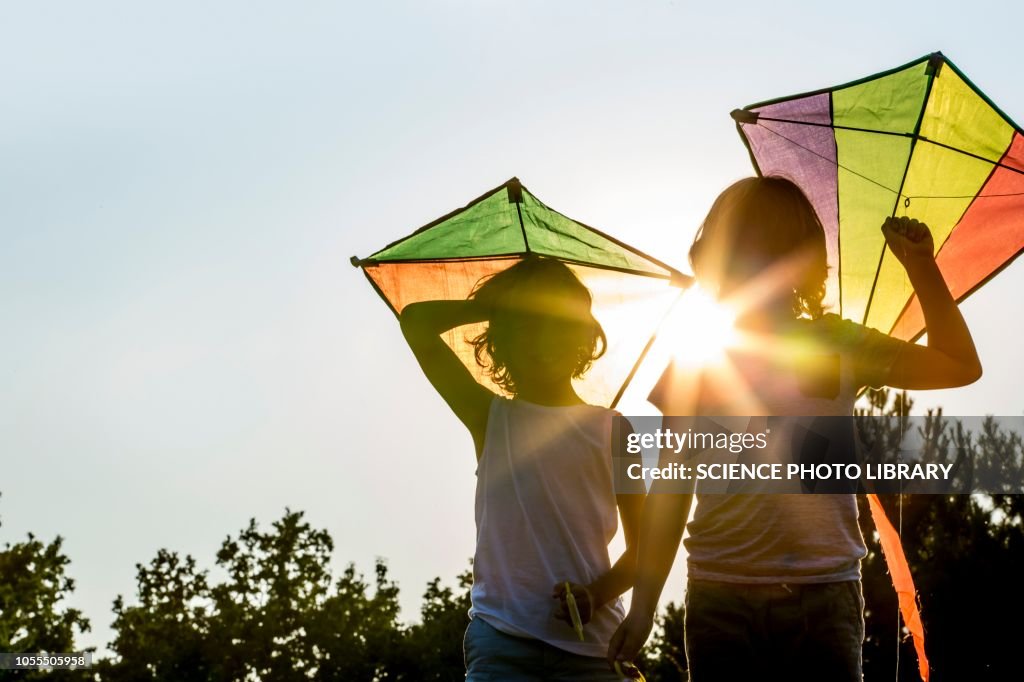 Boys holding kite