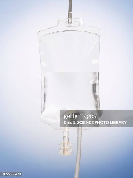 intravenous drip against a plain background - infuus stockfoto's en -beelden