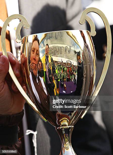 Jockey Chris Munce is reflected in the Caulfield Cup during the presentations after Descarado won race 8 the BMW Caulfield Cup during Caulfield Cup...