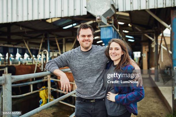 dairy is our passion - young farmer stock pictures, royalty-free photos & images