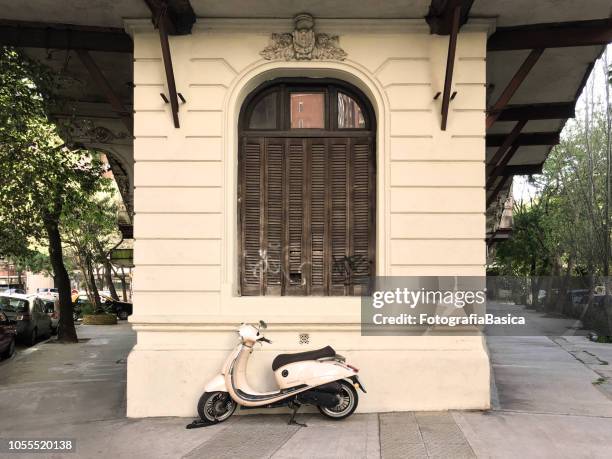 scooter parked in the street - buenos aires travel stock pictures, royalty-free photos & images