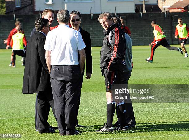 In this handout image supplied by Liverpool Football Club, new owner John W. Henry meets manager Roy Hodgson during a team training session at...