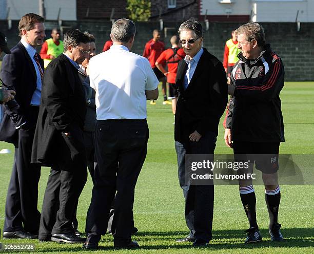 In this handout image supplied by Liverpool Football Club, new owner John W. Henry meets manager Roy Hodgson during a team training session at...