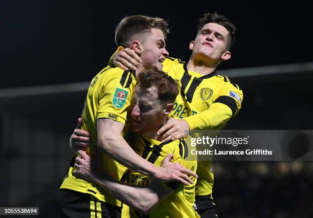 Jake Hesketh of Burton Albion celebrates as he scores his team's third goal with Stephen Quinn and Ben Fox during the Carabao Cup Fourth Round match...
