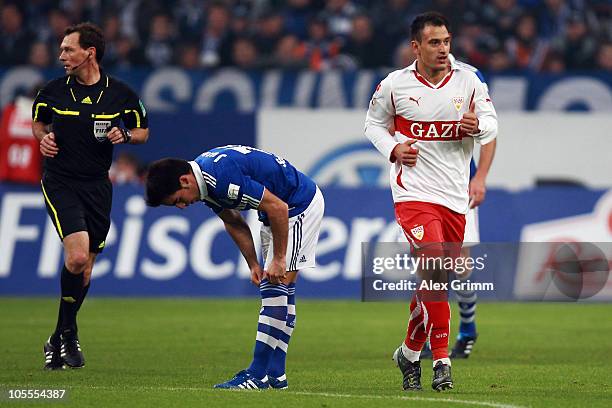 Timo Gebhart of Stuttgart celebrates his team's first goal as he passes Jose Manuel Jurado of Schalke during the Bundesliga match between FC Schalke...