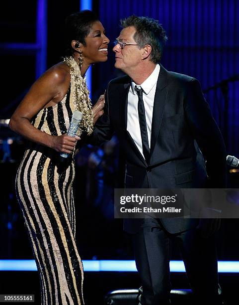 Singer Natalie Cole and producer/composer David Foster greet each other during the David Foster and Friends concert at the Mandalay Bay Events Center...