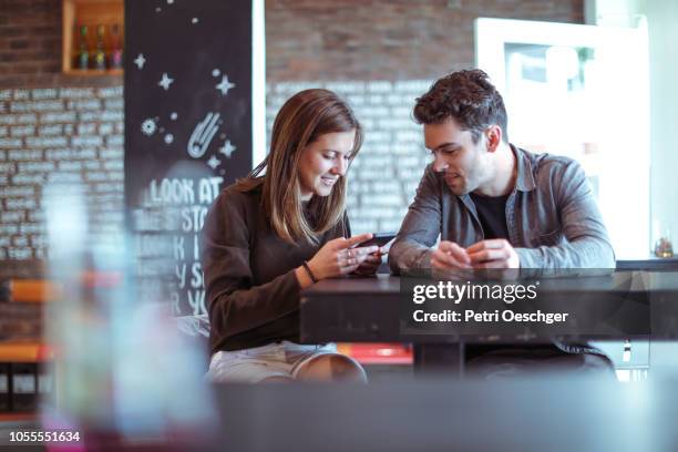 a group of friends enjoying some wine. - small talk bar stock pictures, royalty-free photos & images