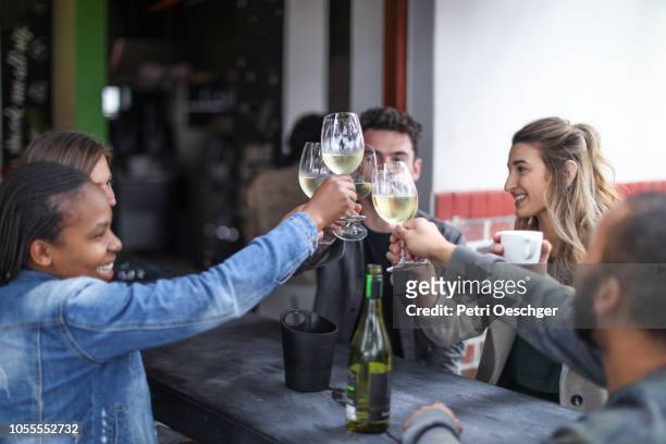 a group of friends enjoying some wine. - stellenbosch wine bildbanksfoton och bilder