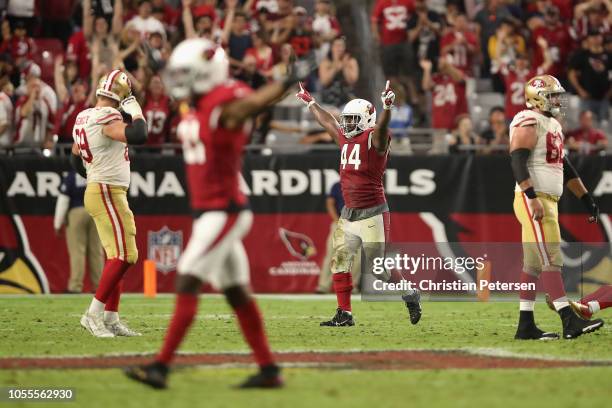 Defensive end Markus Golden of the Arizona Cardinals reacts after defeating the San Francisco 49ers during the NFL game at State Farm Stadium on...