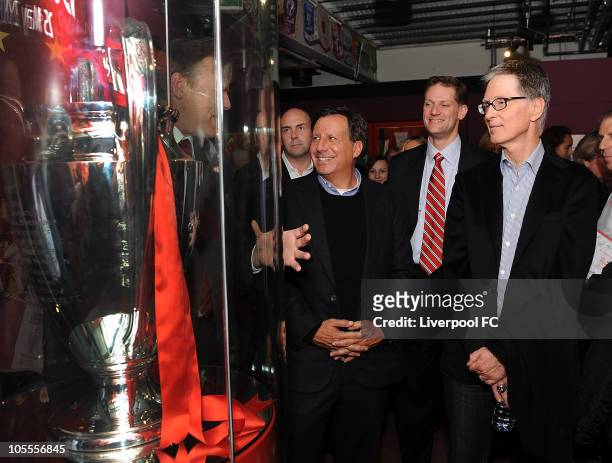 In this handout image supplied by Liverpool Football Club, Thomas Werner, Joe Januszewski and John W Henry look at the Champions League Trophy at the...