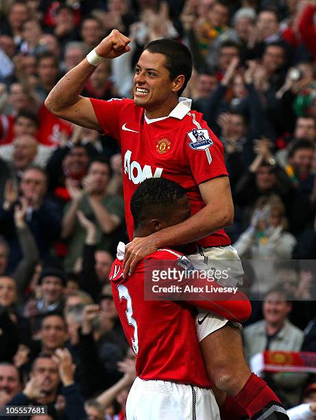 Javier Hernandez of Manchester United celebrates with Patrice Evra after scoring the first goal during the Barclays Premier League match between...