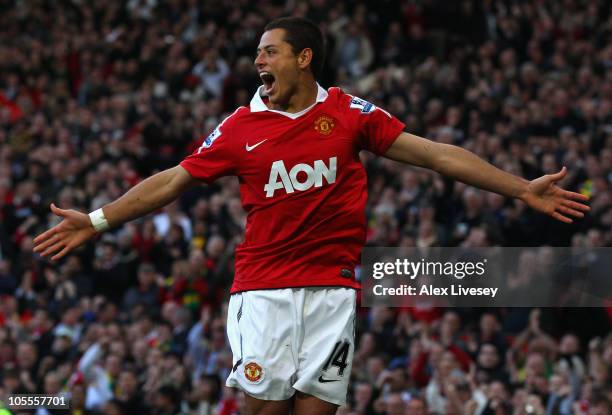 Javier Hernandez of Manchester United celebrates after scoring the first goal during the Barclays Premier League match between Manchester United and...