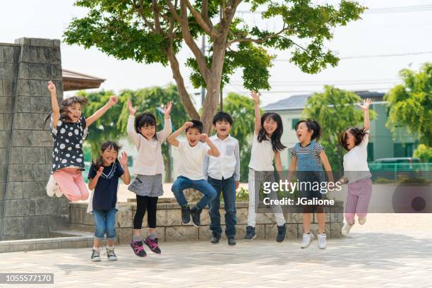 group of school friends outdoors - childhood stock pictures, royalty-free photos & images