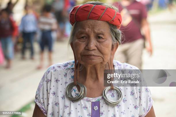 close up of dayak female with long earlobes - dayak stock pictures, royalty-free photos & images