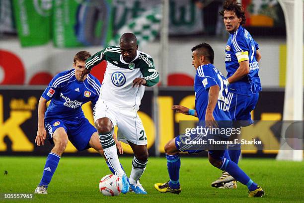 Daniel Schwaab of Leverkusen, Grafite of Wolfsburg and Arturo Vidal and Manuel Friedrich of Leverkusen in action during the Bundesliga match between...