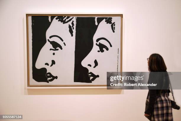 Museum visitor admires a 1961 painting, titled 'Before and After', by Andy Warhol at the San Francisco Museum of Modern Art in San Francisco,...