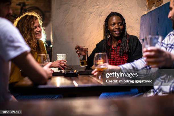 positive atmosphere at pub - busy pub stock pictures, royalty-free photos & images