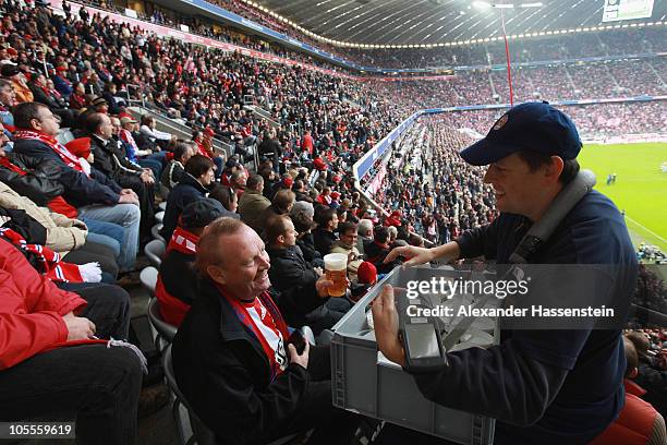 Service worker sells beer in the stands during the Bundesliga match between FC Bayern Muenchen and Hannover 96 at Allianz Arena on October 16, 2010...