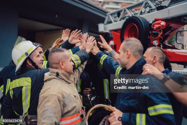 Firefighters doing high five