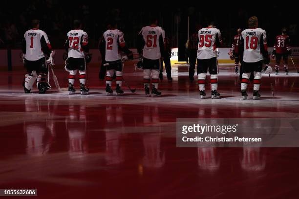 Mike Condon, Thomas Chabot, Dylan DeMelo, Mark Stone, Matt Duchene and Ryan Dzingel of the Ottawa Senators stand attended for the Canadien national...