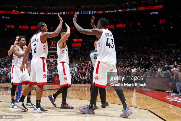 Kawhi Leonard and Pascal Siakam of the Toronto Raptors high five during the game against the Philadelphia 76ers on October 30, 2018 at Soctiabank...