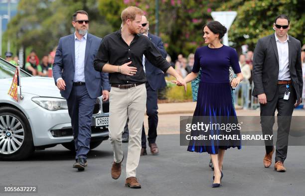 Britain's Prince Harry and Meghan, Duchess of Sussex arrive for a public walkabout at the Rotorua Government Gardens in Rotorua on October 31, 2018....
