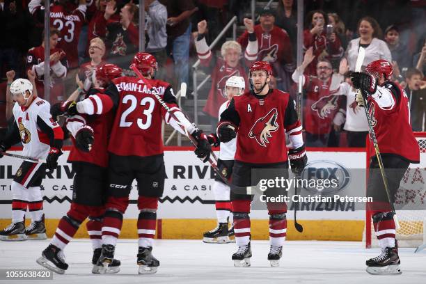 Clayton Keller, Oliver Ekman-Larsson, Derek Stepan and Alex Galchenyuk of the Arizona Coyotes celebrate after Ekman-Larsson scored a power-play goal...