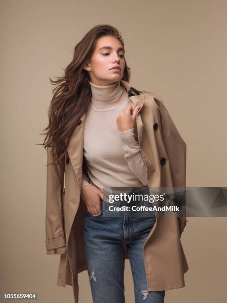 portrait of young woman in autumn coat - denim coat stock pictures, royalty-free photos & images