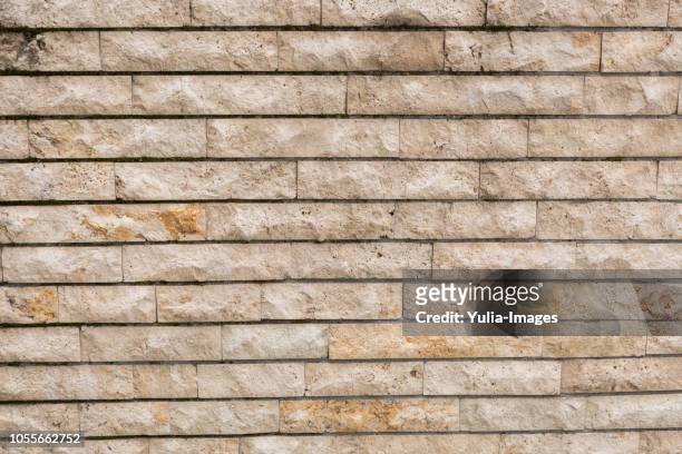 decorative rough finish clay brick wall - beige brick stock pictures, royalty-free photos & images