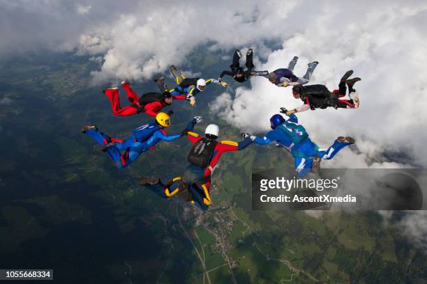 skydivers fall towards the earth - medium group of people stock pictures, royalty-free photos & images