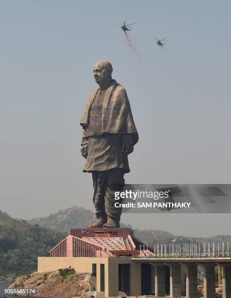 Indian Air Force helicopters shower rose petals on the "Statue Of Unity", the world's tallest statue dedicated to Indian independence leader Sardar...