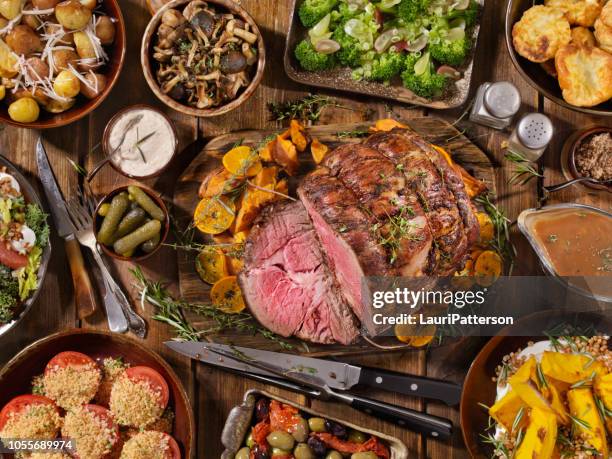 roast beef feast - christmas meal stock pictures, royalty-free photos & images