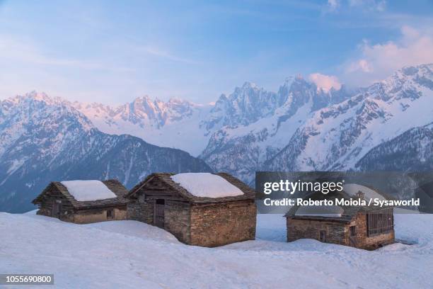 alpine huts in the snow, tombal, switzerland - cottage ストックフォトと画像