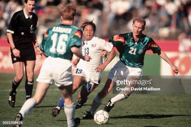Cobi Jones of the USA and Dieter Eilts of Germany play in an international friendly match on December 18, 1993 at Stanford Stadium in Palo Alto,...