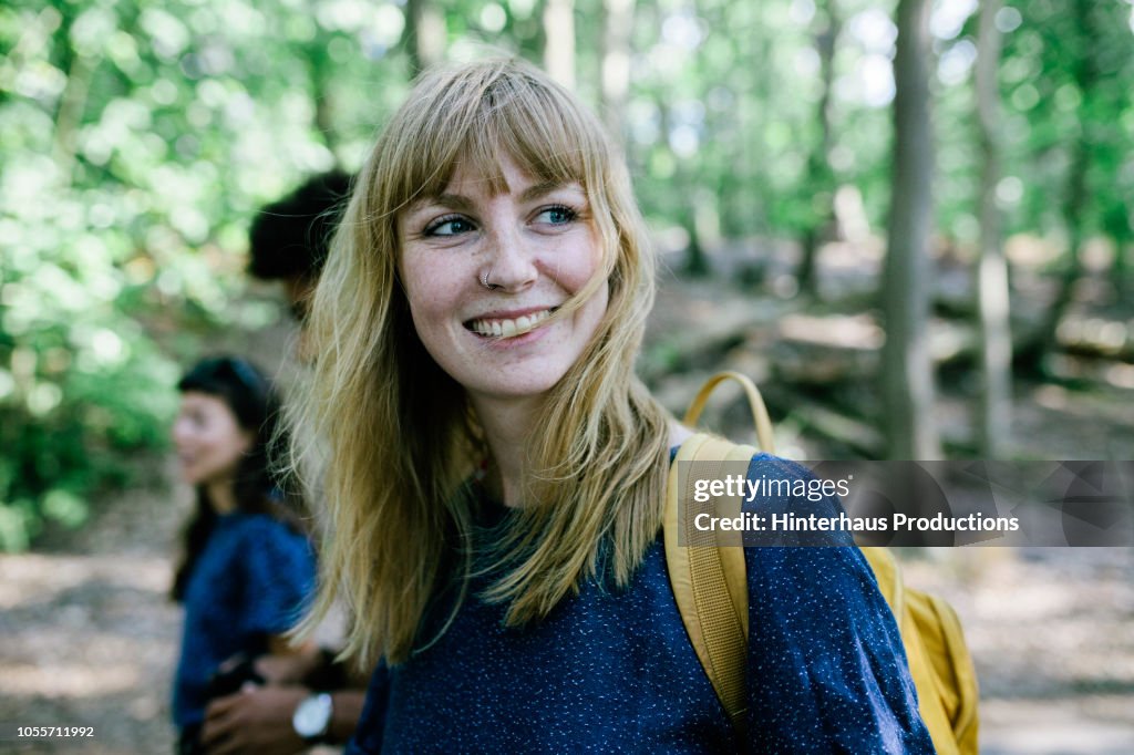 Young Woman On Way To Lake With Friends
