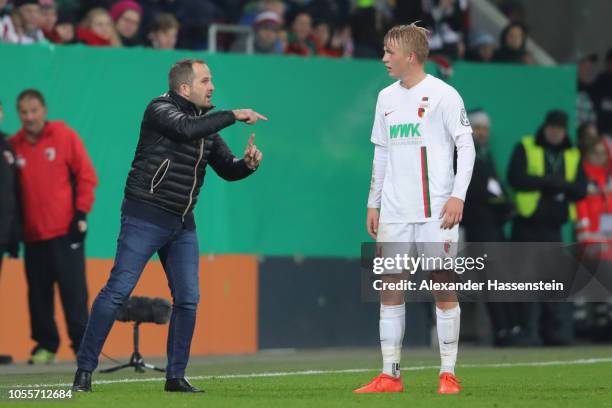 Manuel Baum, head coach of Augsburg reacts to his player Felix Goetze during the DFB Cup match between FC Augsburg and 1. FSV Mainz 05 at WWK-Arena...