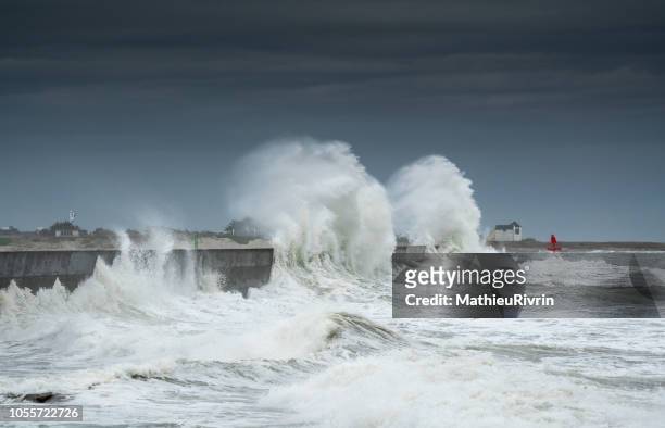 powerful storm against the coast and the harbor in the south of brittany - extreme weather stock pictures, royalty-free photos & images