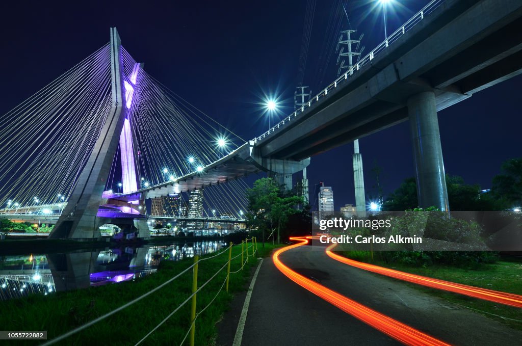 Sao Paulo, Brazil - Octavio Frias de Oliveira Bridge at night with S-shaped light trail of a vehicle in movement