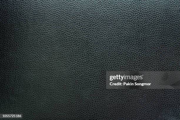 close up black leather and texture background - grey purse stockfoto's en -beelden