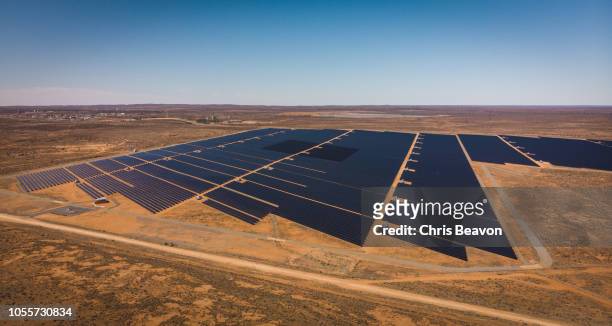 aerial shot of desert solar electricity plant - australia desert stock pictures, royalty-free photos & images